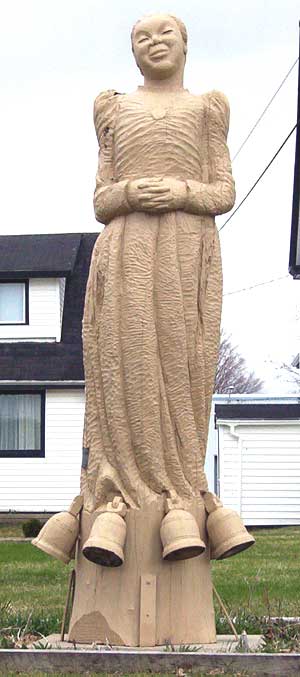 Portia White wood carving in front of Zion United Baptist Church